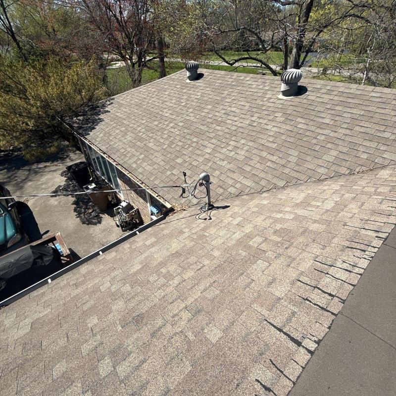 Asphalt shingle roof with ventilation turbines and wiring