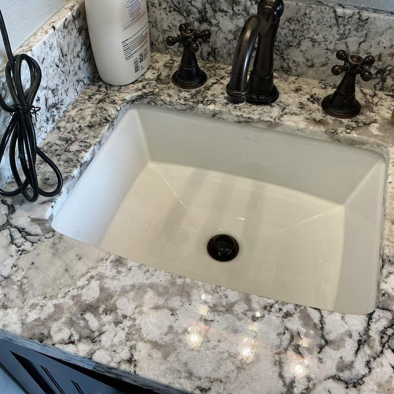 Master vanity drain clogged with hair and debris cleared