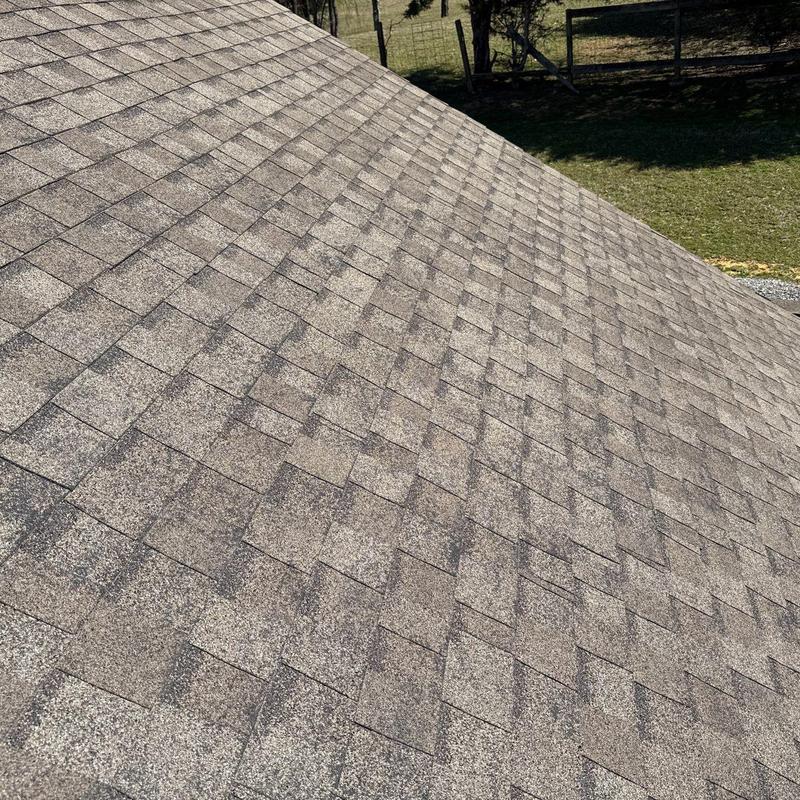 Asphalt shingle roof with visible hail damage
