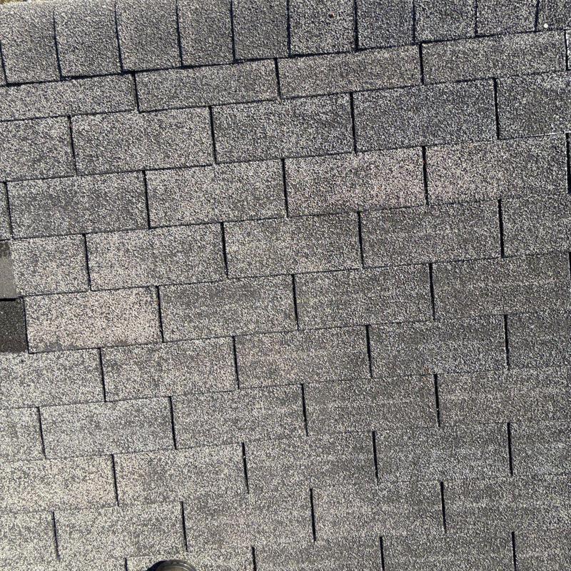 Asphalt shingles with hail damage on residential roof
