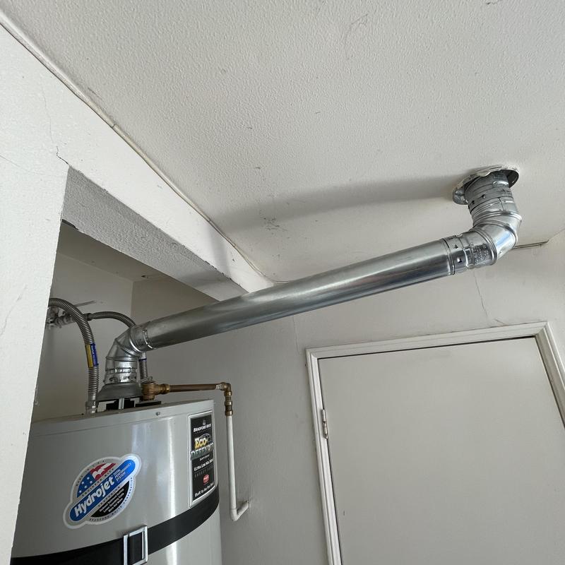 Water heater double wall vent pipe installation