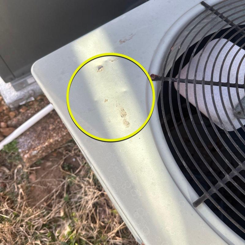 Air conditioner unit with dent and rust spots