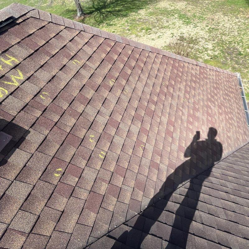 Asphalt Shingles with Hail Damage Markings on Roof