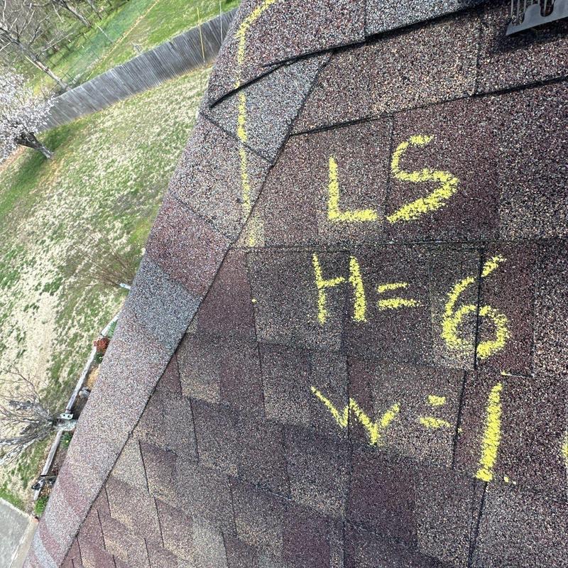 Asphalt shingles with hail damage markings