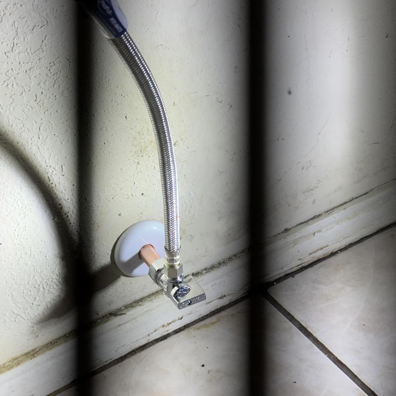 Toilet supply line and shutoff valve installed under wall