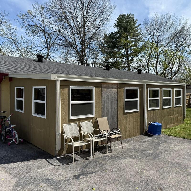 Asphalt shingle roof with ridge caps and ventilation