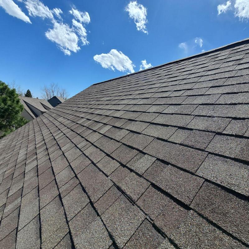 Asphalt shingle roof with resealed pipe jacks, clear sky Asphalt shingle roof with resealed pipe jacks, clear sky