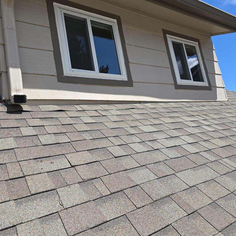 Asphalt shingle roof with sealed pipe jacks and windows Asphalt shingle roof with sealed pipe jacks and windows