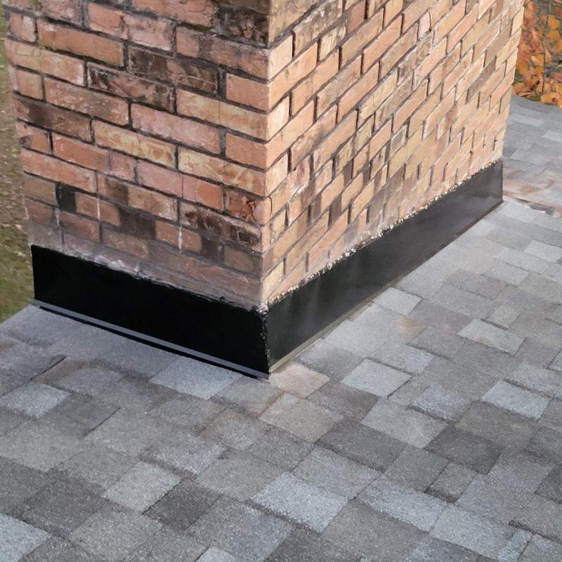 Coastal Granite shingle roof with brick chimney flashing