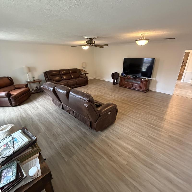 Vinyl plank flooring in spacious living room Vinyl plank flooring in spacious living room