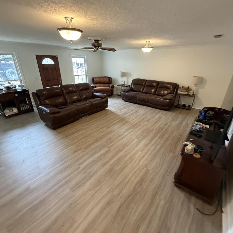 Vinyl plank flooring installation in living room Vinyl plank flooring installation in living room