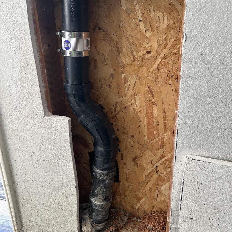 2-inch ABS drain pipe with new coupling installed