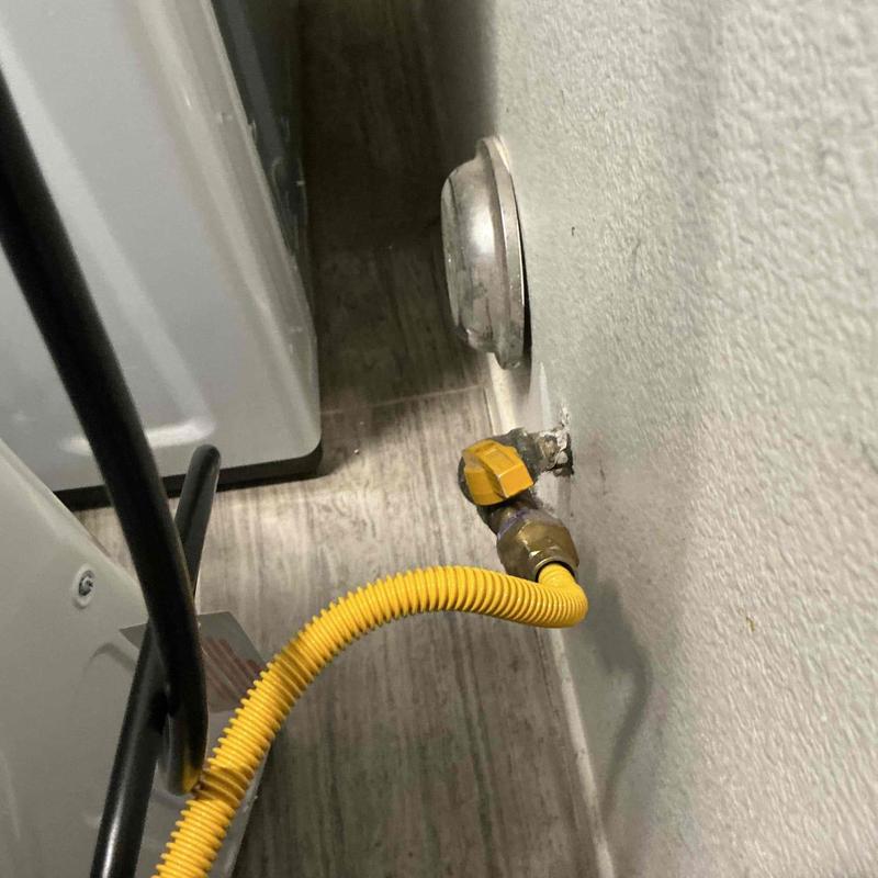 Dryer gas valve with yellow flexible gas line installed
