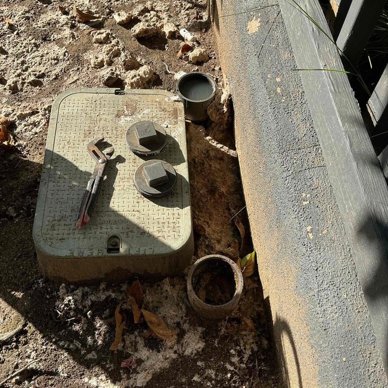 Main sewer line cleanout with plumbing wrench