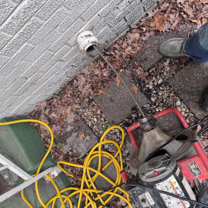 Outdoor drain cleanout with drain snake and equipment