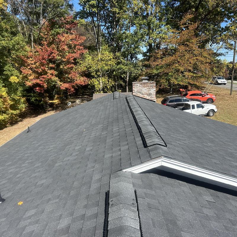 Black Shadow shingles on ranch roof in autumn setting