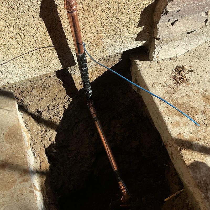 Type L copper service line installation by garage exterior