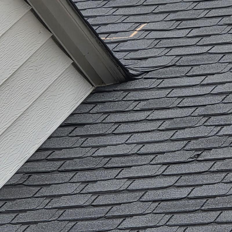 Asphalt roof shingles with potential storm damage markings