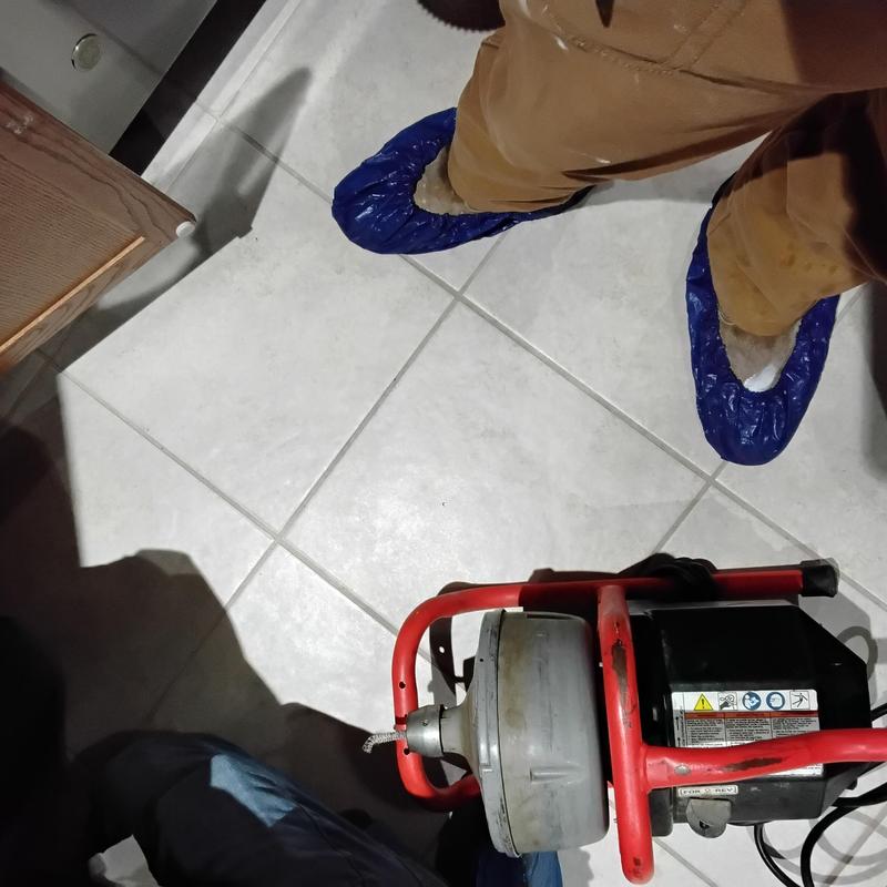 Kitchen sink drain cable machine with operator feet