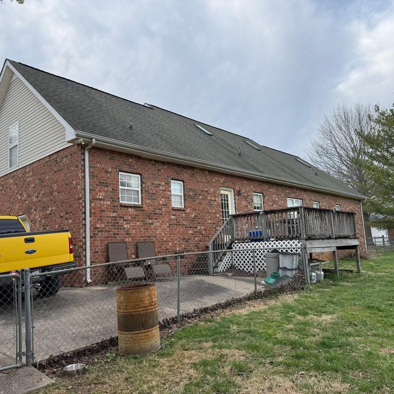 Roof shingles with hail damage on residential home