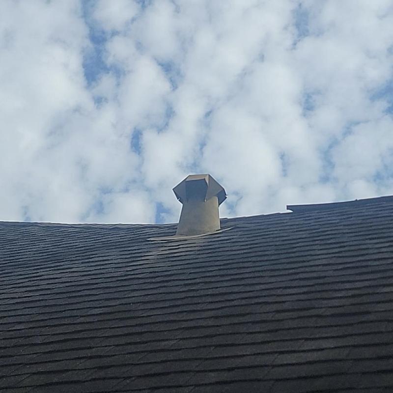 Exhaust vent flashing on asphalt shingle roof