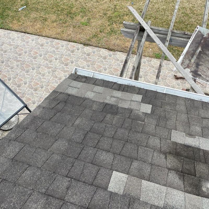 Asphalt shingle roof with new replacement shingles