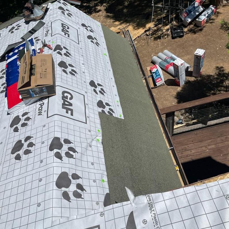 Roof underlayment installation on cabin roof deck