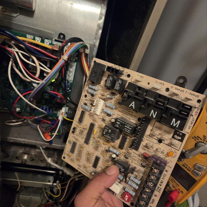 Carrier furnace control board being replaced with multimeter nearby Carrier furnace control board being replaced with multimeter nearby