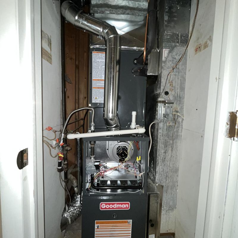 Goodman gas furnace with vent piping in utility room Goodman gas furnace with vent piping in utility room