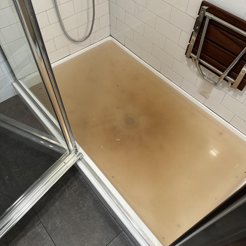 Shower drain with water backup and discoloration