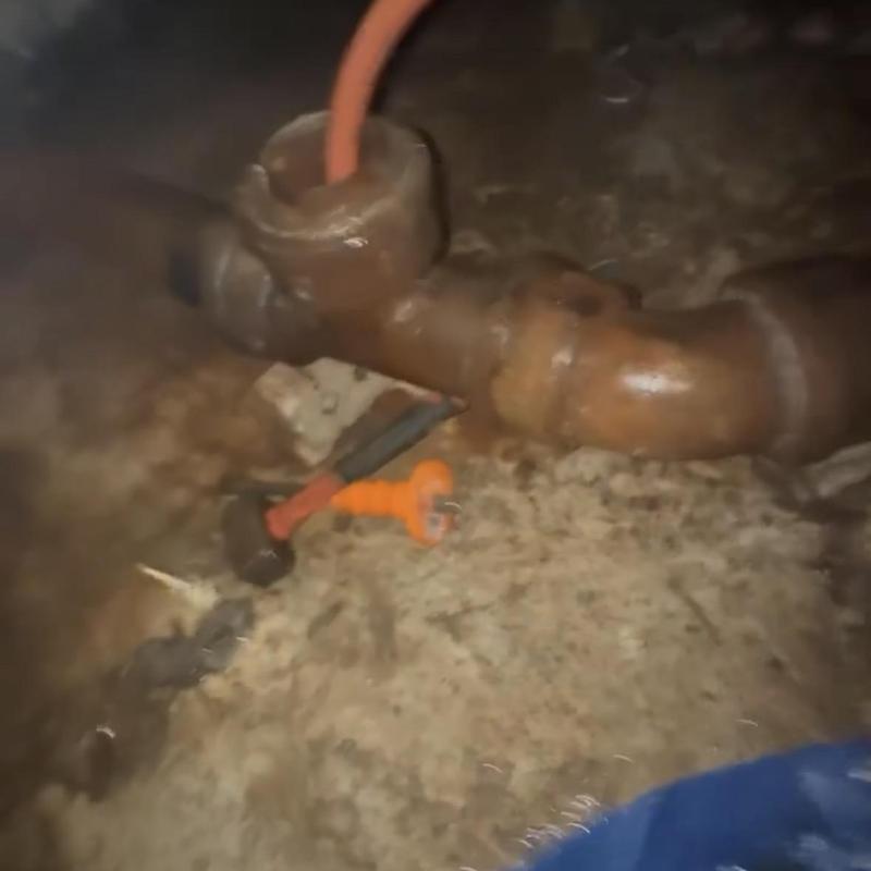 Building sewer main line with plumbing tools inside