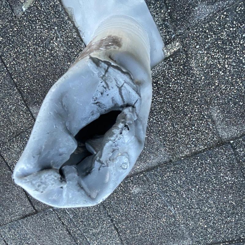 Cracked plumbing vent boot on asphalt shingle roof
