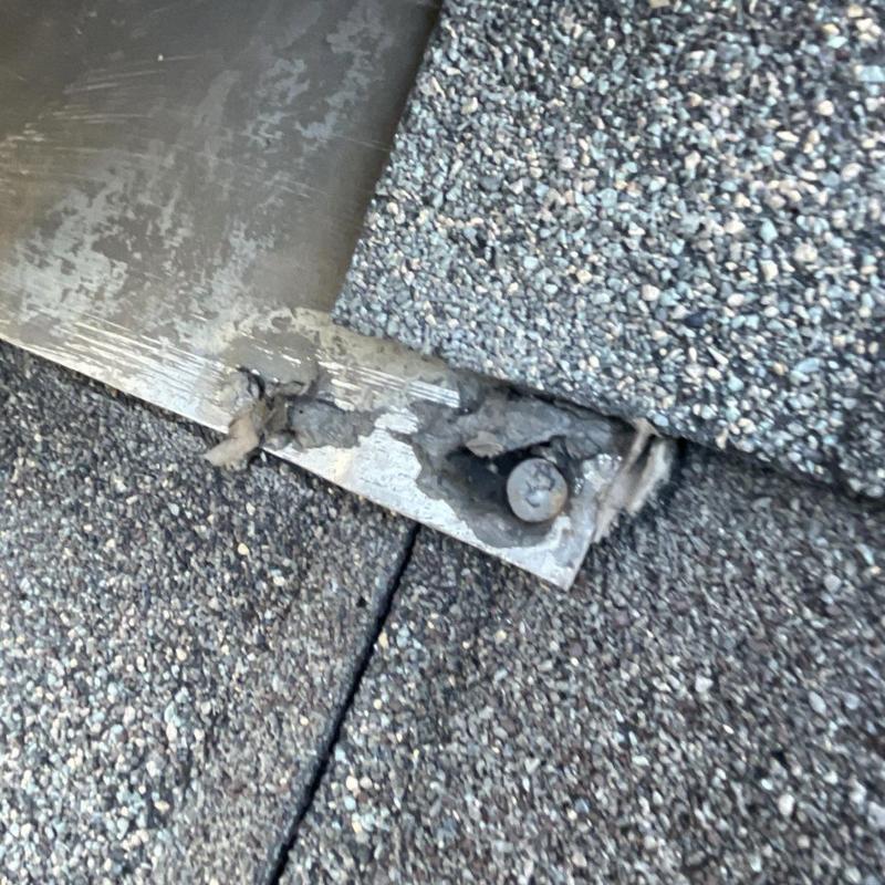 Metal flashing with cracked sealant and exposed nail