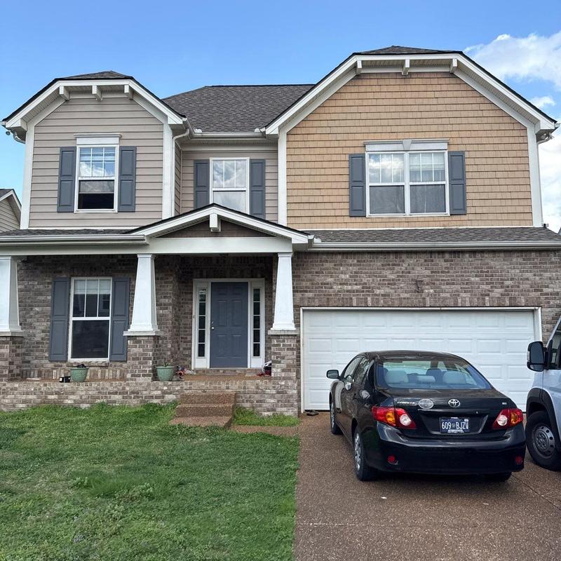 Asphalt shingle roof with hail damage inspection