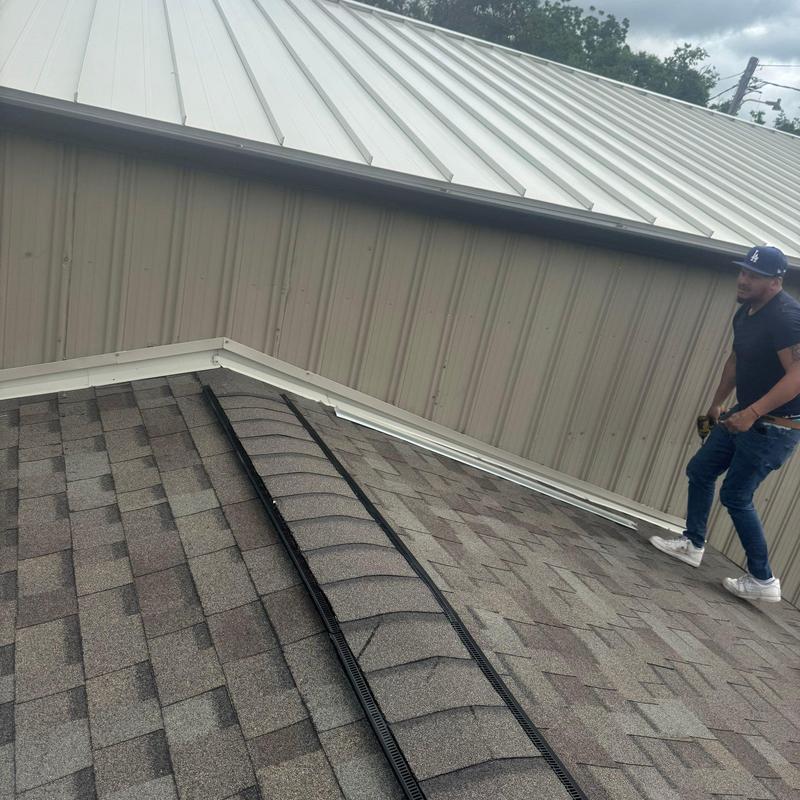 Asphalt shingle roof inspection with ridge vent and flashing