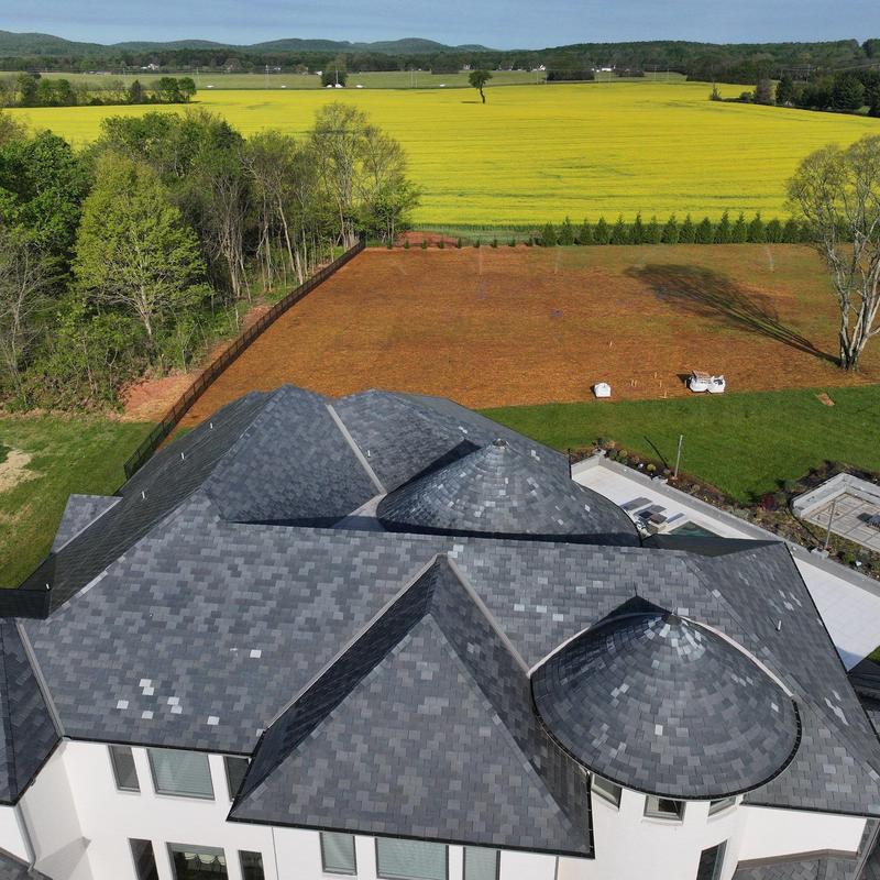 Asphalt shingle roof with dome structures and ridge caps
