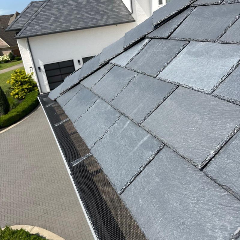 Slate roof shingles with gutter guard installation