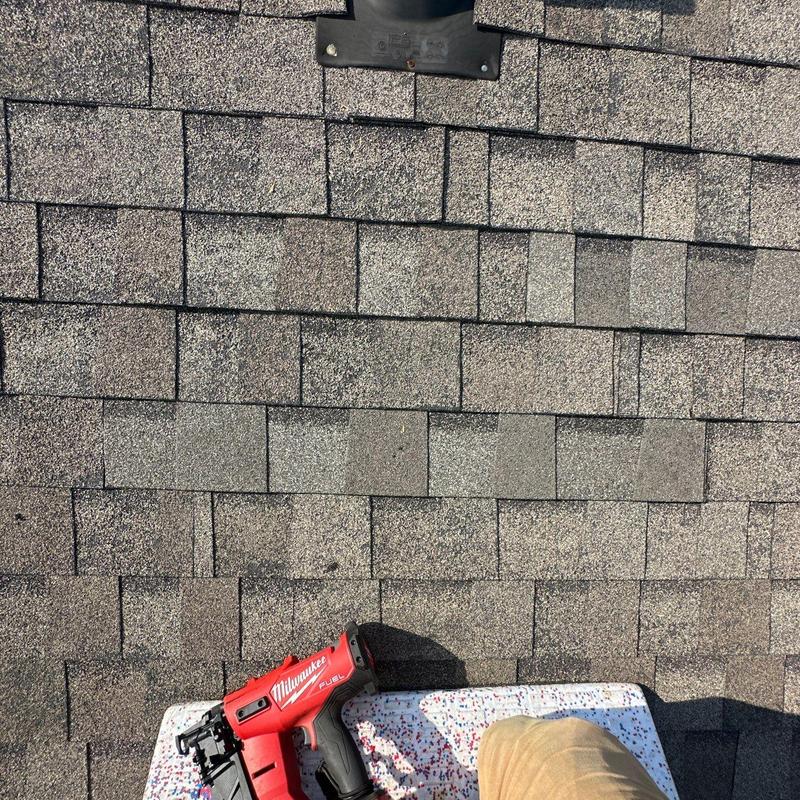 Roof shingles with hail damage and pneumatic nail gun