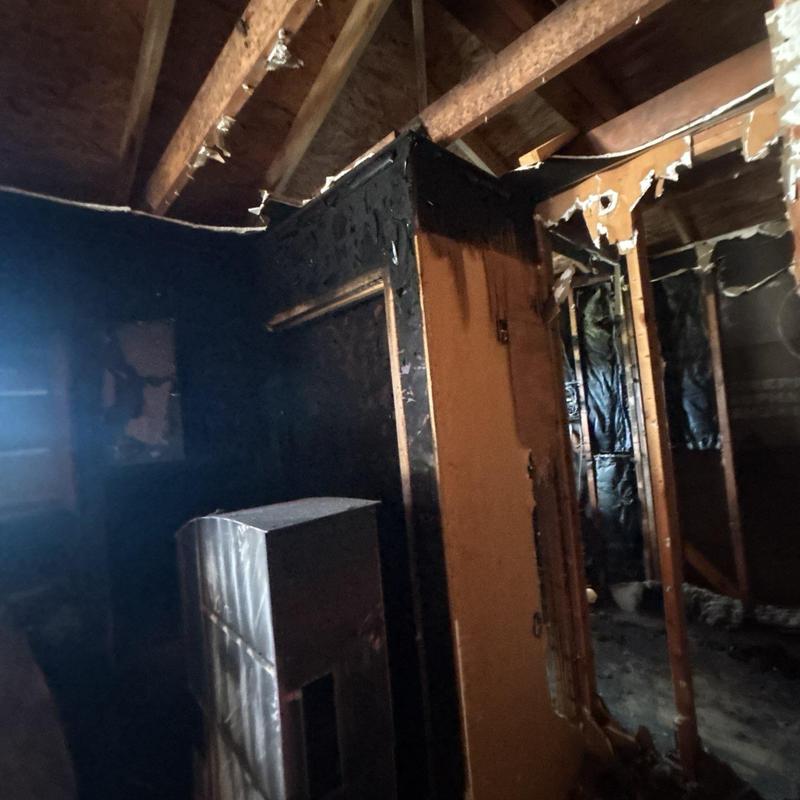 Fire-damaged interior walls and exposed roof framing