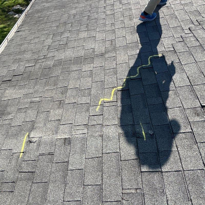 Asphalt shingles roof with hail damage markings