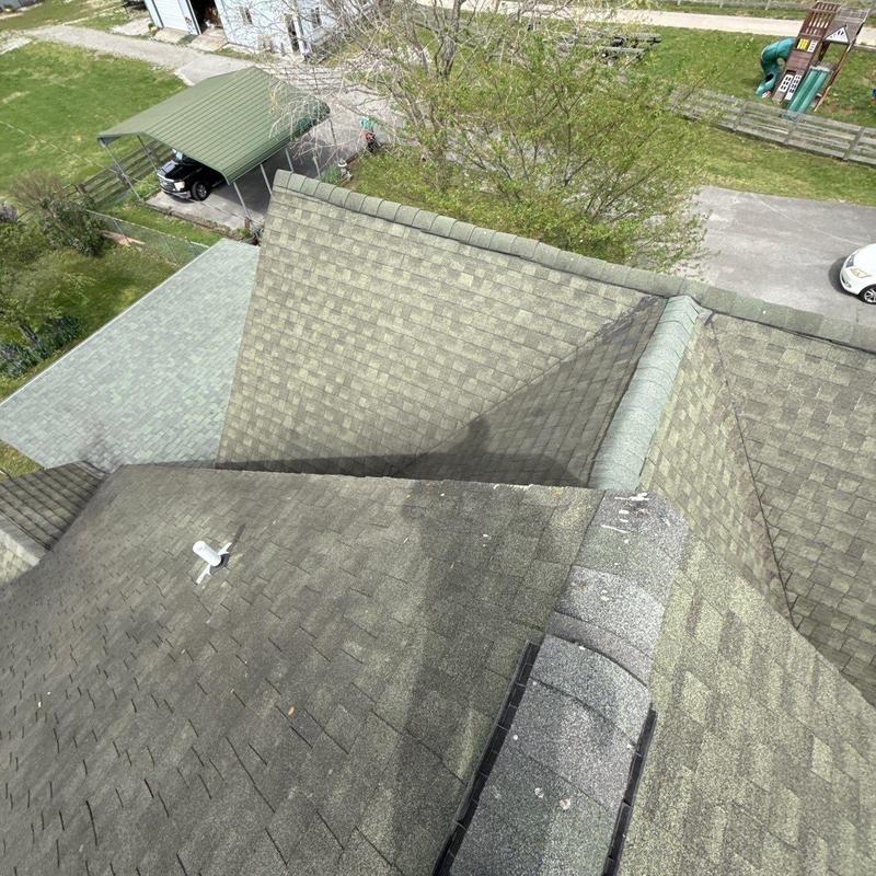 Asphalt shingle roof with ridge vent and flashing details