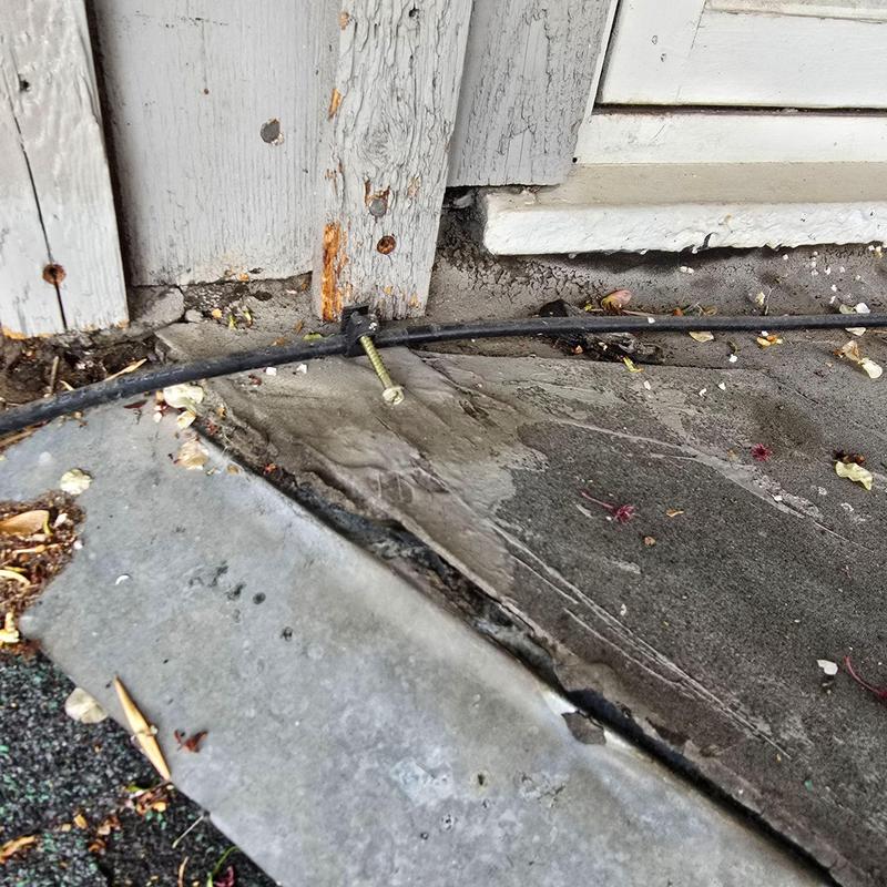 Window sill wood rot and cracked concrete near door threshold Window sill wood rot and cracked concrete near door threshold