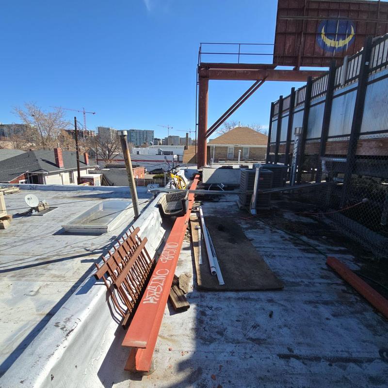 Flat roof with temporary leak repairs and materials Flat roof with temporary leak repairs and materials