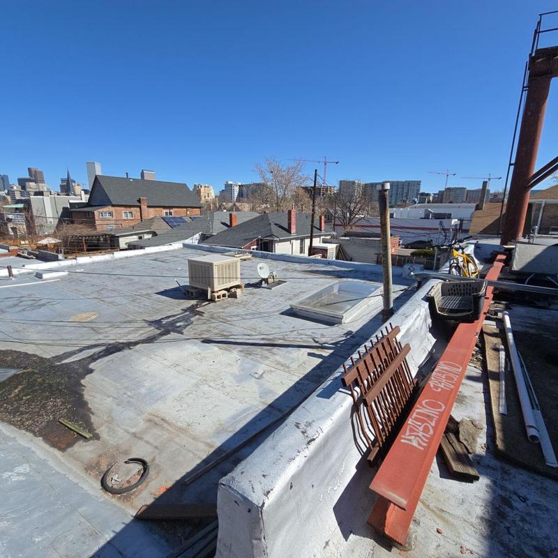 Flat roof with HVAC unit and skylight in Denver Flat roof with HVAC unit and skylight in Denver
