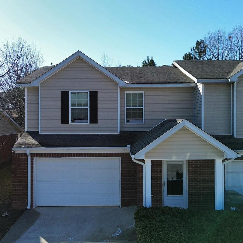Asphalt shingle roof on townhouse exterior