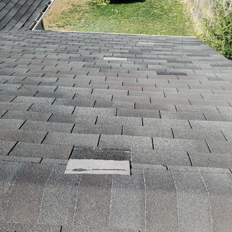 Roof shingles with wind damage and resealed pipe jacks Roof shingles with wind damage and resealed pipe jacks