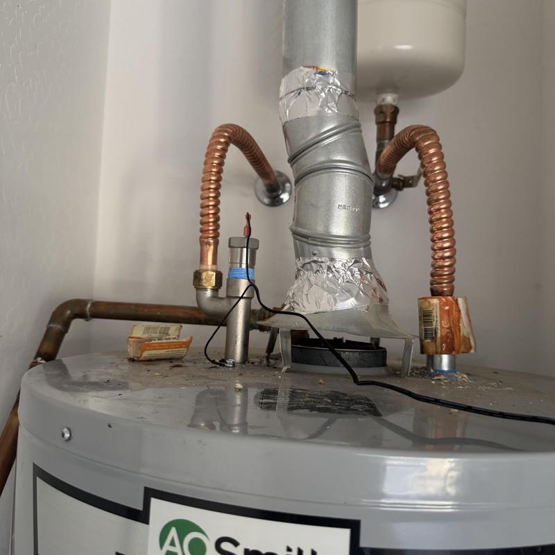 Electric anode rod installed on water heater tank