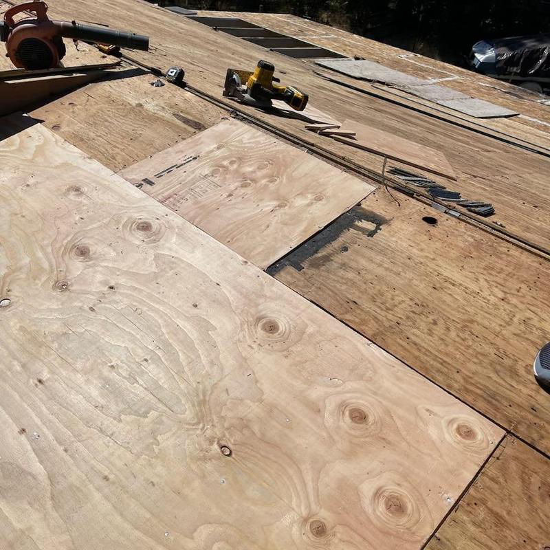 Plywood roof decking repair with new sheets installed