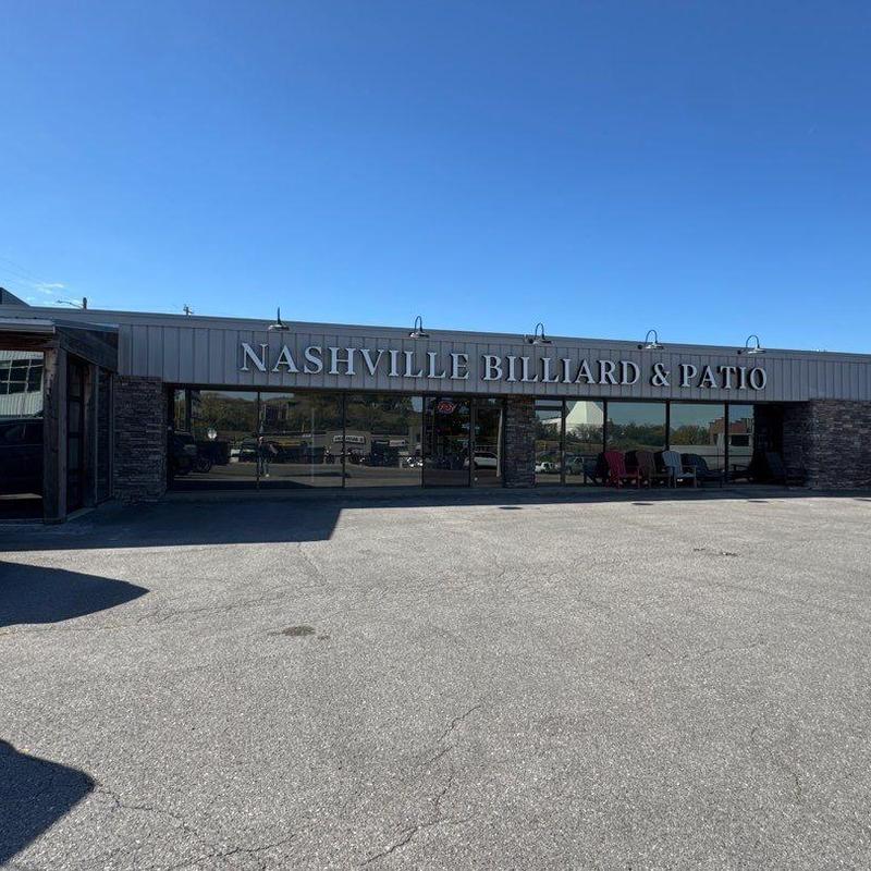 Commercial flat TPO roof connected to metal roof exterior