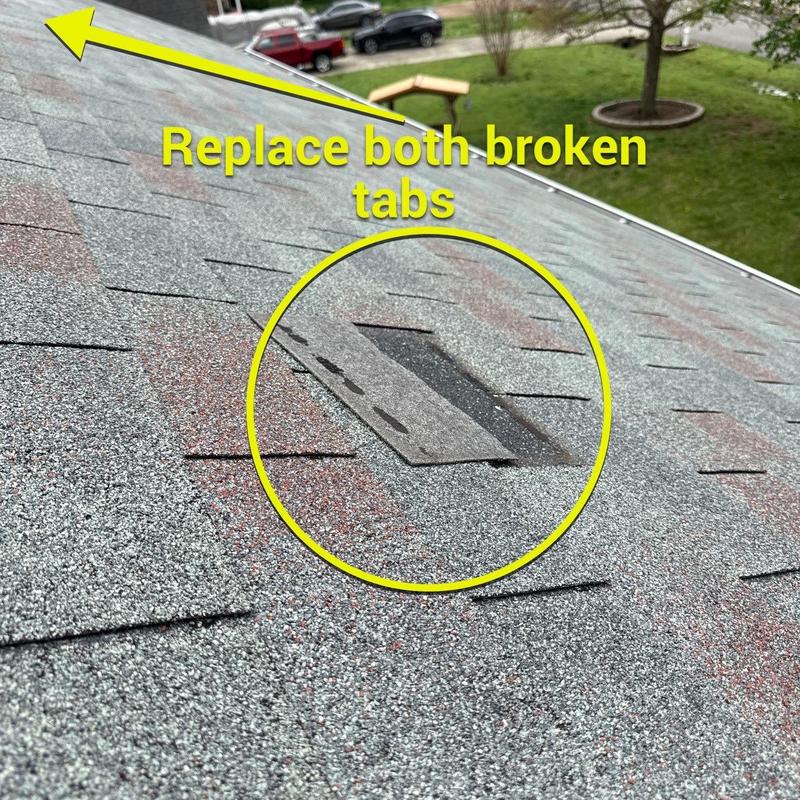 Roof shingles with broken tabs marked for replacement